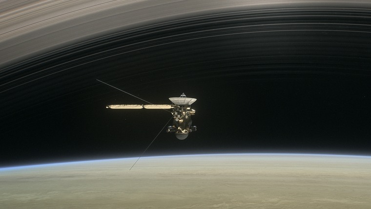 Image: In a still from the short film Cassini's Grand Finale, an artist's rendering shows the spacecraft diving between Saturn and the planet's innermost ring.