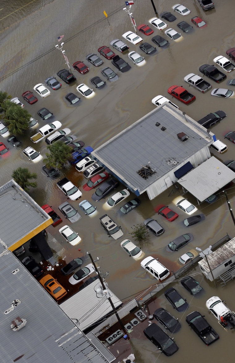 Image: Cars and businesses are flooded near the Addicks Reservoir