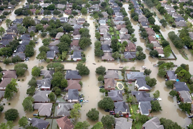 Image: Houses are seen submerged in flood waters caused by Tropical Storm Harvey in Houston