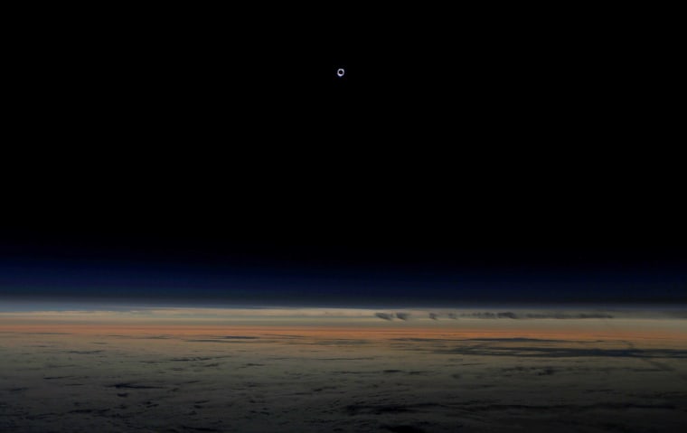 Image: The sun is obscured by the moon during a solar eclipse as seen from an Alaska Airlines commercial jet at 40,000 feet above the Pacific Ocean off the coast of Depoe Bay, Oregon, U.S.