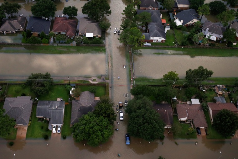 Image: Houses are seen partially submerged in flood waters caused by Tropical Storm Harvey in Northwest Houston, Texas