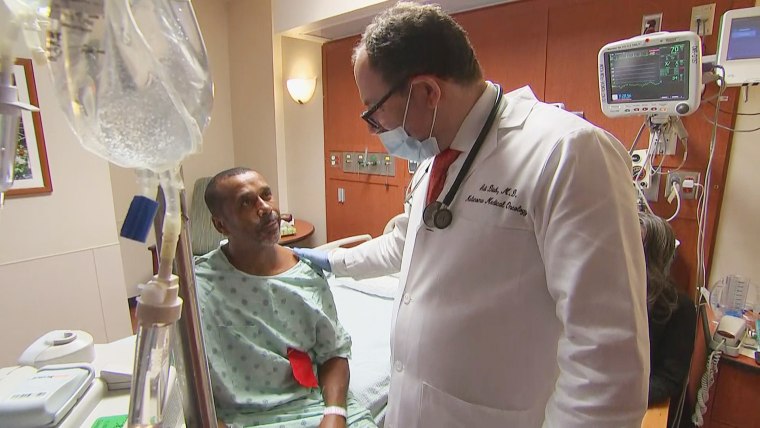 Image: Dr. Adi Diab waded through flood waters in Texas to treat his cancer patient.