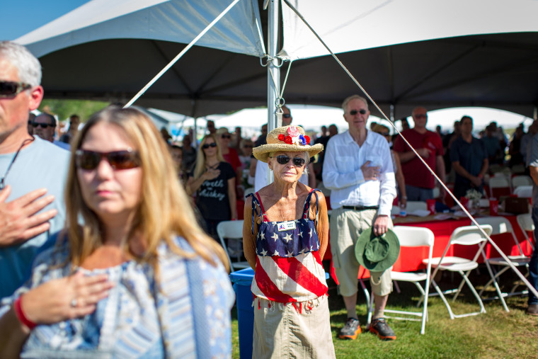 Image: Clare Price, center, of Incline Village, Nevada, looks on during the national anthem