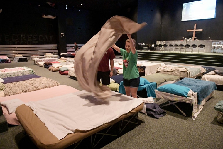 Image: Youths in a shelter for volunteer rescue workers set up at the Fairfield Baptist Church student building on Aug. 29, 2017 in Cypress, Texas.