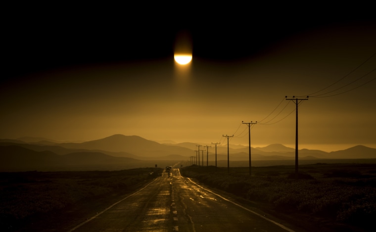 Image: A road stretches along the Atacama desert in Chile's Huasco region