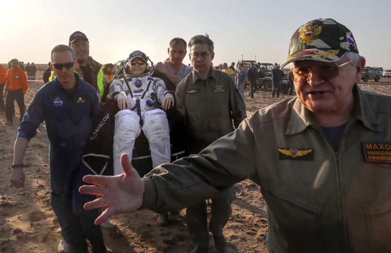 Image: Ground personnel carry U.S. astronaut Peggy Whitson after landing in a remote area outside the town of Jezkazgan, Kazakhstan, Sept. 3, 2017.