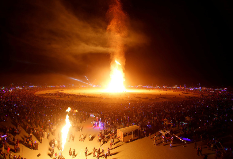 Image: The Man is engulfed in flames as approximately 70,000 people from all over the world gathered for the annual Burning Man arts and music festival in the Black Rock Desert of Nevada