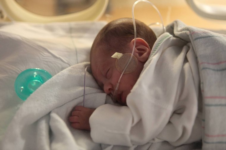 Preterm baby at a NICU in New York. A new study finds people can carry germs into the units on their clothing.