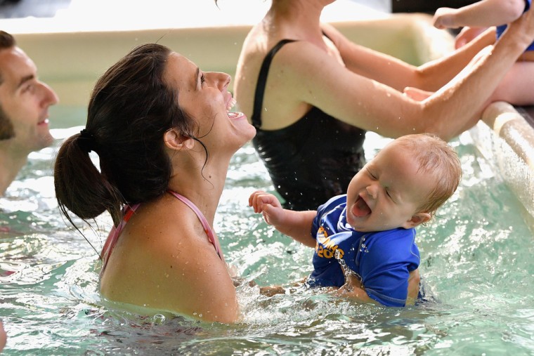 My baby didn't mind going under water, as long as I did one helpful trick right before. 