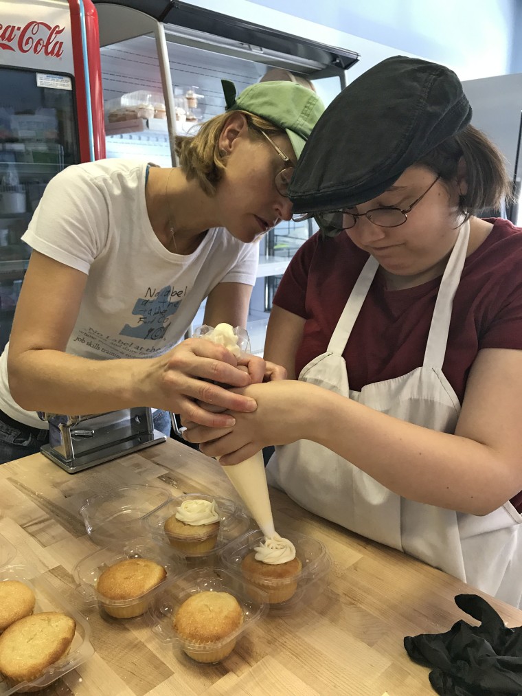 Reed ices a cupcake