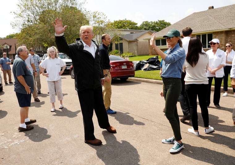 Image: U.S. President Donald Trump and first lady Melania Trump greet residents in a neighborhood during a visit with flood survivors and volunteers during recovery efforts of Hurricane Harvey in Houston