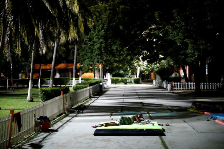 Image: A resident sleeps outside after an earthquake struck off the southern coast of Mexico.