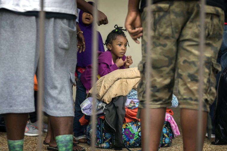 Image: An unidentified little girl waits with her family at the Savannah Civic Center to evacuate from he path of Hurricane Irma, Sept., 9, 2017 in Savannah, Georgia.