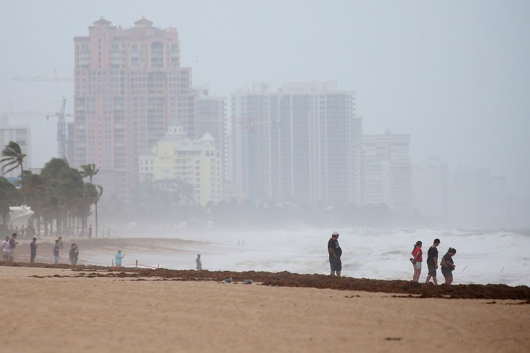 Image: People walk along the beach in advance of Hurricane Irma's expected arrival in Fort Lauderdale, Florida