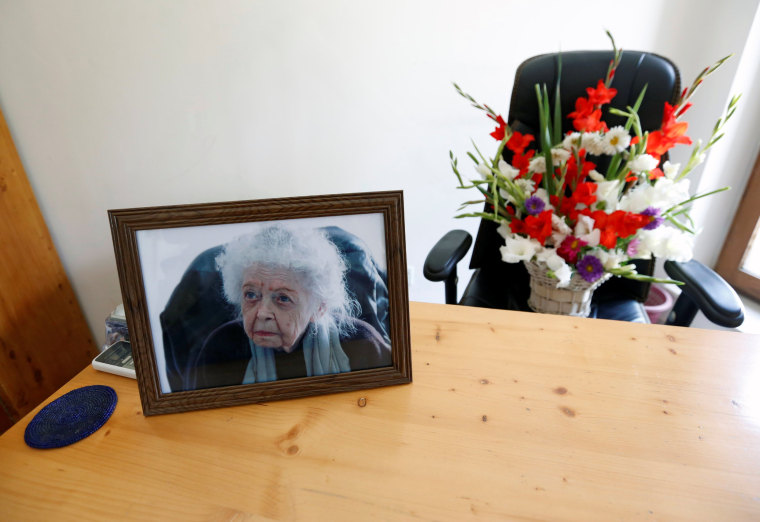 Image: A photo of Nancy Hatch Dupree and flowers at her office in Kabul after she passed away.