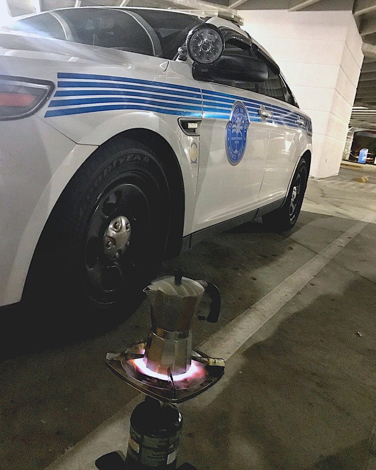 Image: The Miami Police Department places a Cuban \"cafetera\" on a makeshift burner in Miami as officers prepare for the arrival of the hurricane on Sept. 9.