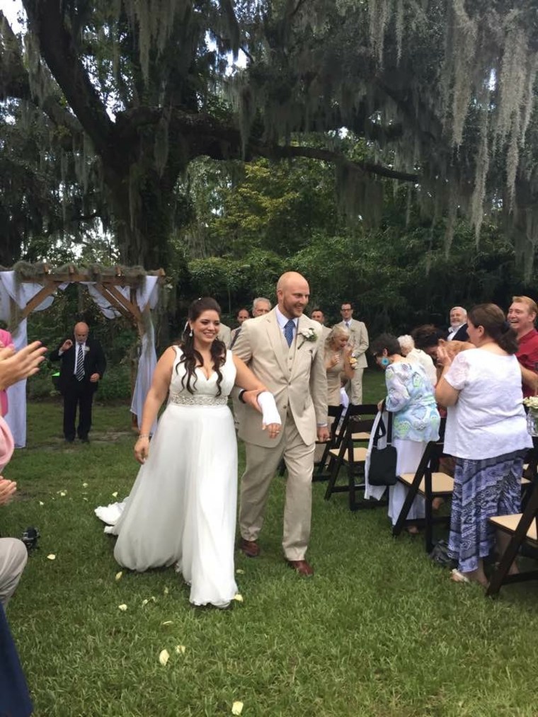 Wedding party cheers up bride with a broken wrist by wearing Ace bandages in funny photo