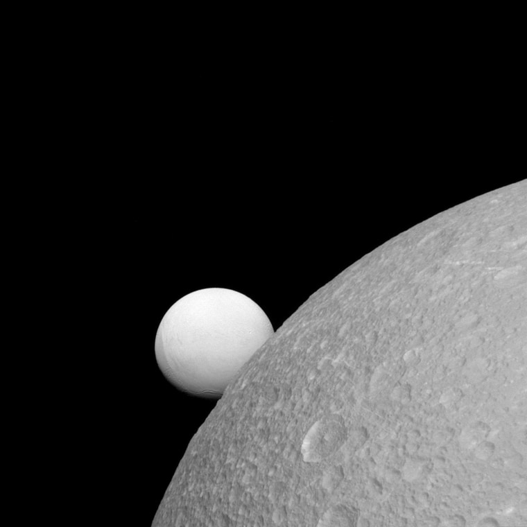 Image: Two of Saturn's moons are seen in a NASA handout image