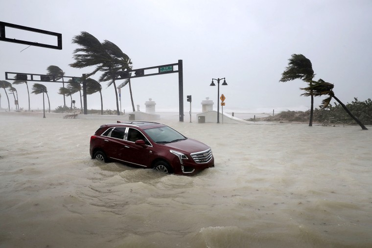 Image: A car sits abandoned in storm surge from Hurricane Irma