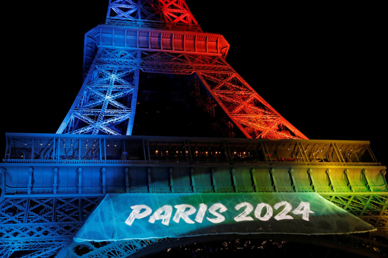 Image: The Eiffel Tower is Lit in the Colors of the Olympic Flag