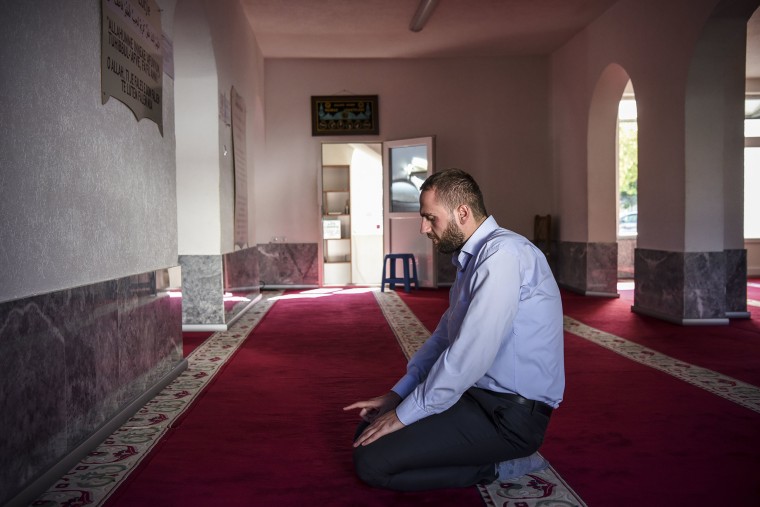 Image: Albert Berisha prays in Ferizaj