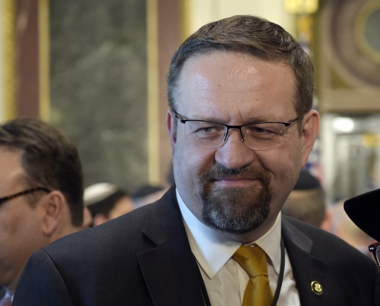 Image: Sebastian Gorka talks with people in the Treaty Room in the Eisenhower Executive Office Building