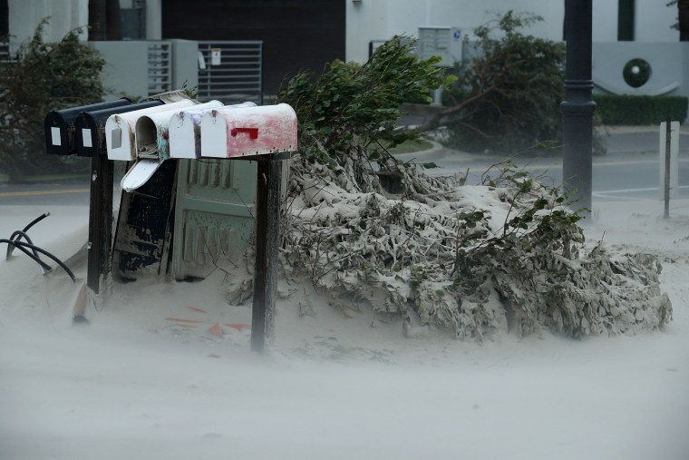 Image: Blown sand from Pompano Beach coats bushes and mailboxes on Sept. 10.