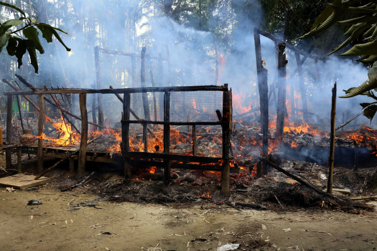 Image: A house on fire in the north of Rakhine, Myanmar