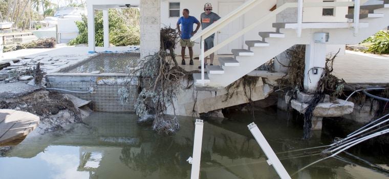 Image: People survey the damage to their homes by Hurricane Irma in Islamorada, in the Florida Keys