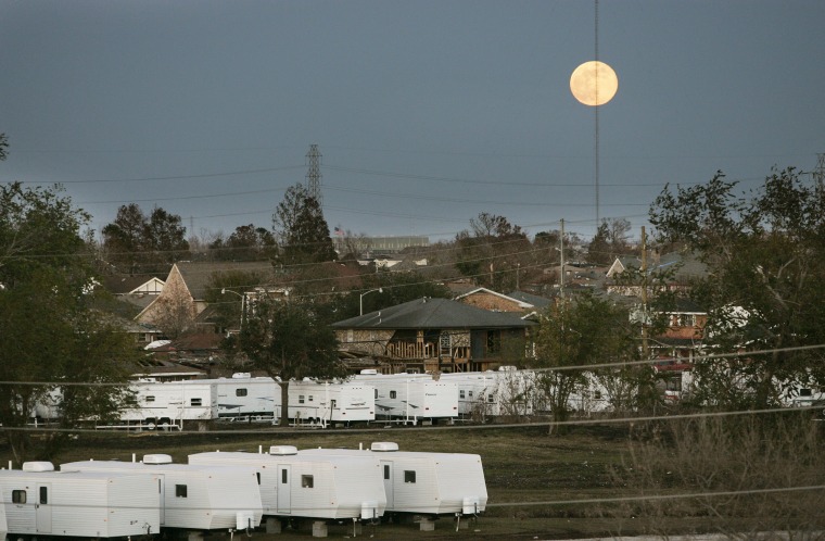 The moon rises over FEMA trailers and damaged homes in St. Bernard Parish, Louisiana on Dec. 15, 2005.