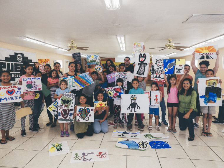 Children and Montoya, at center, at Aliento, in Phoenix, Arizona.