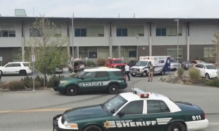 Image: Sheriff's vehicles and an ambulance outside Freeman High School in Spokane