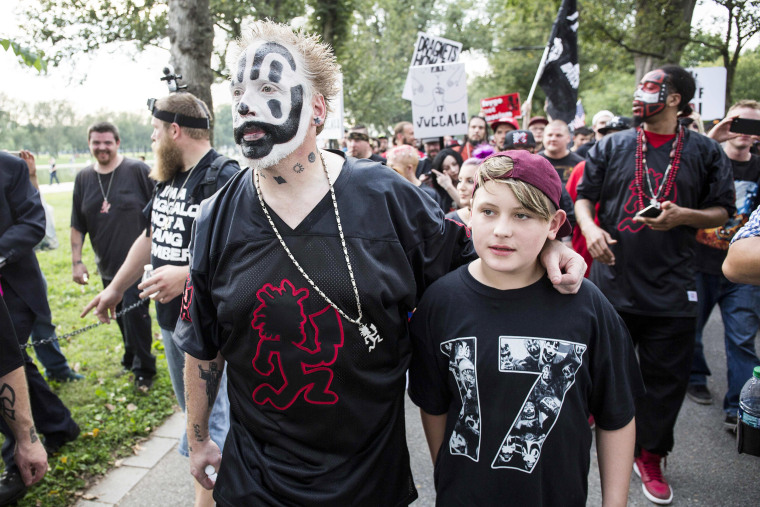 Image: Joseph Bruce, who goes by the stage name Violent J, of the US rap group Insane Clown Posse, leads a group of his fans