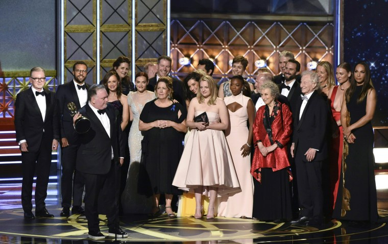 Image: The cast and crew of \"The Handmaid's Tale\" accept the award for Outstanding Drama Series
