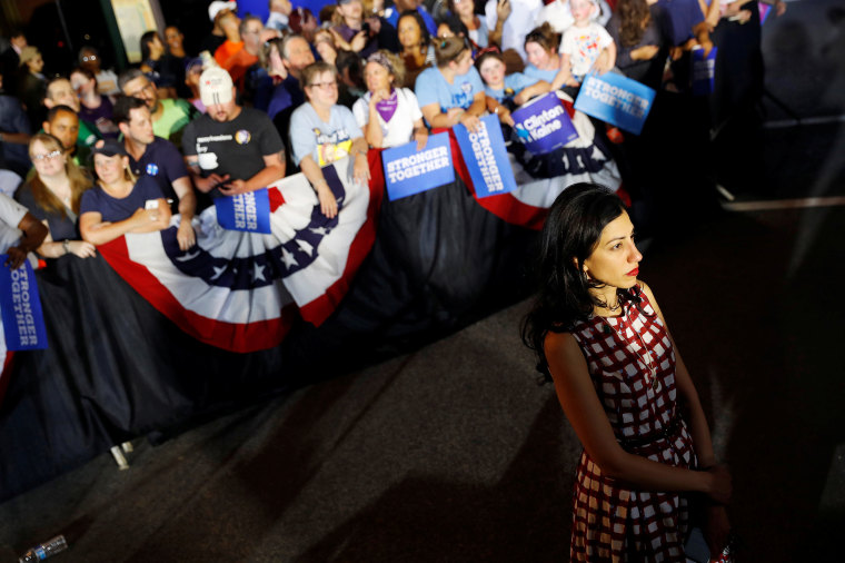 Image: Senior adviser Huma Abedin looks on as then-Democratic presidential candidate Hillary Clinton campaigns with vice presidential candidate Senator Tim Kaine (D-VA) at the Broad Street Market in Harrisburg, Pennsylvania, July 29, 2016.