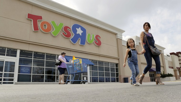 Image: Shoppers leave a Toys R Us store