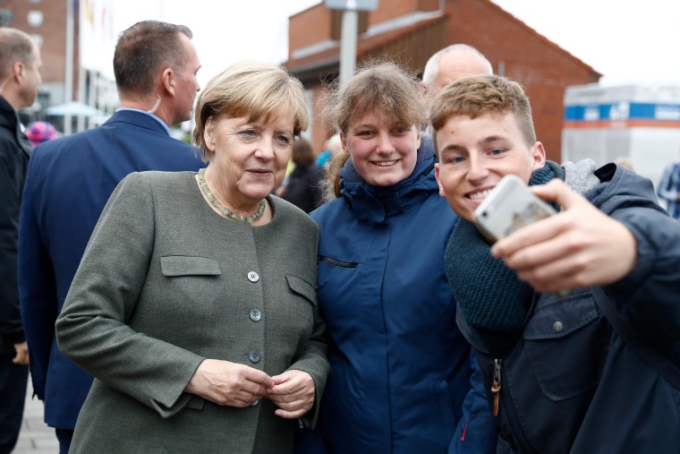 Image: Angela Merkel poses for a selfie