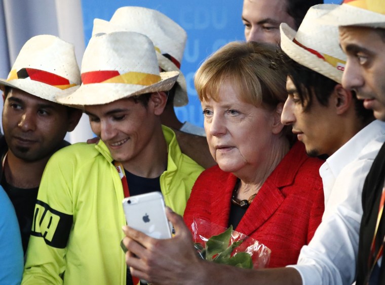 Image: Angela Merkel with Syrian refugees