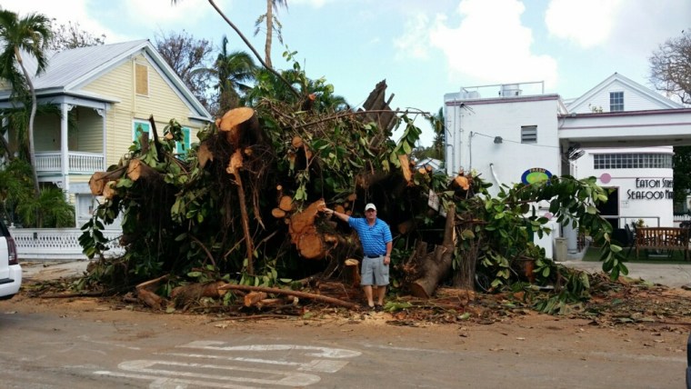 Jim Gilleran next to a downed tree in Key West, Fla.