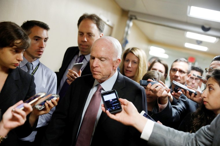 Image: Sen. John McCain (R-AZ) speaks with reporters ahead of the party luncheons on Capitol Hill in Washington