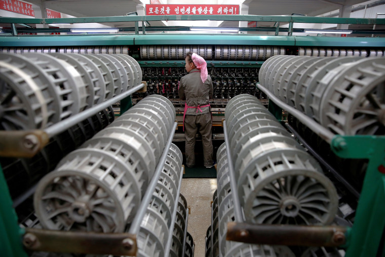 Image: FILE PHOTO - A woman works at the Kim Jong Suk Pyongyang textile mill during a government organised visit for foreign reporters in Pyongyang