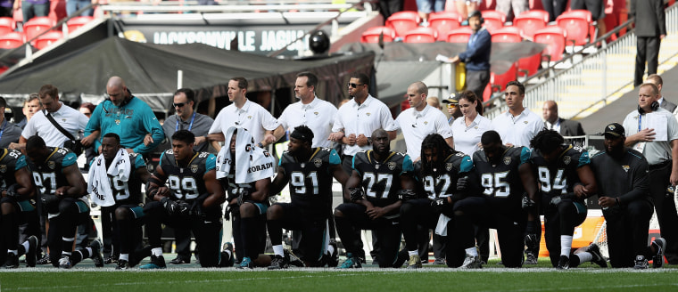 Jacksonville Jaguars players show their protest during the National Anthem during the NFL International Series match