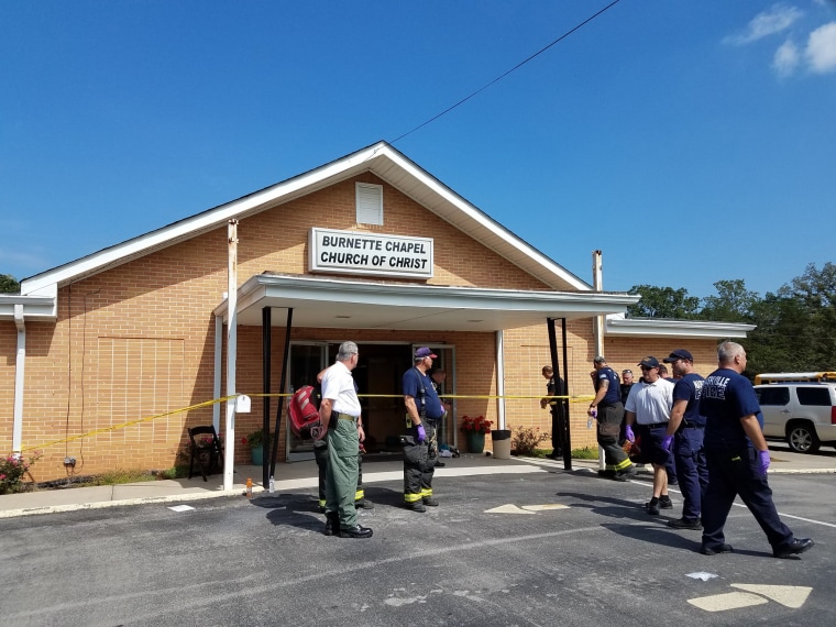 Image: Members of the Nashville Fire Department stand outside the Burnette Chapel Church of Christ in Antioch