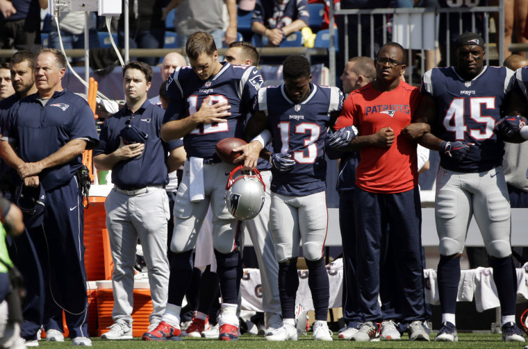 Image: New England Patriots head coach Bill Belichick, left, and Tom Brady (12) Phillip Dorsett (13) Matthew Slater, second from right, and David Harris (45) stand during the national anthem