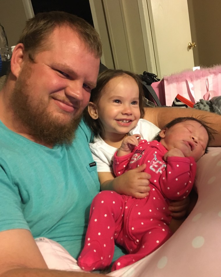Justin LaFrance with the couple's two daughters, Kendall, 2, and Lachlyn, 3 months.