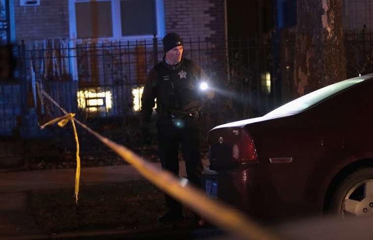 Image: Police investigate the scene of a shooting in Chicago on Jan. 1, 2017. The shooting of two people brought the number of people shot in Chicago to 4000 people in 2016-- one of the most violent years in the city in two decades.