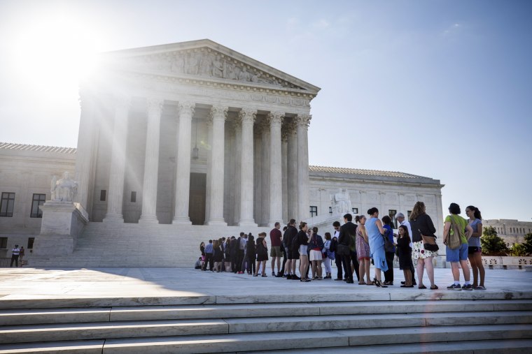 Image: People gather outside the Supreme Court