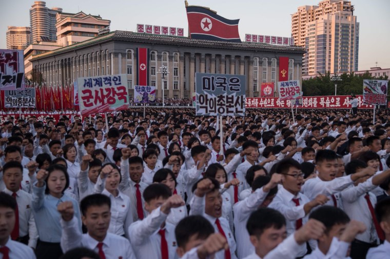 Image: North Koreans at mass rally