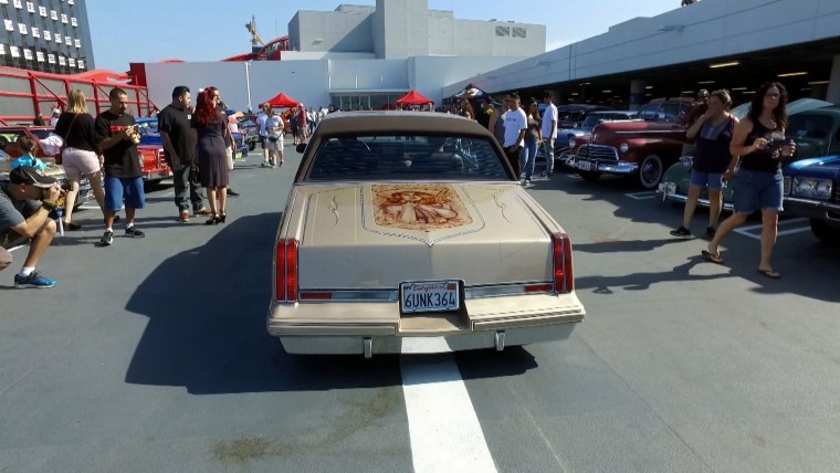 Lowrider cars in front of the Petersen Automotive Museum in Los Angeles, CA.