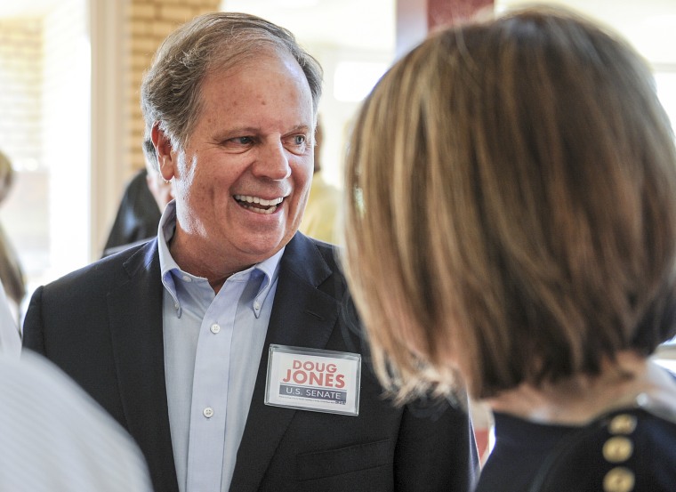 Image: Candidate Doug Jones chats with constituents